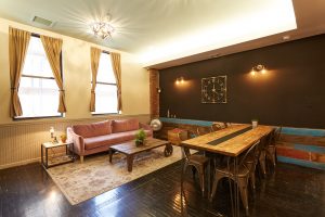 A couch area and workspace at The Farm Soho.