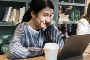 A woman enjoying the benefits of coworking.