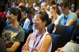 A group of audience members at the Running Remote Conference for remote workers.