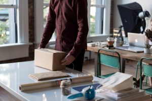 A man opening a virtual office package.