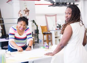 Two women at a coworking space.