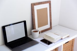 A desk set up in a home office.