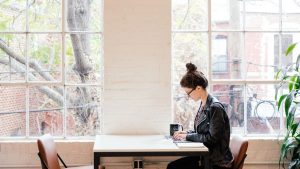 A woman working from a coworking space.