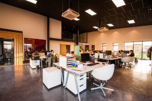 A view of a coworking space filled with remote workers.