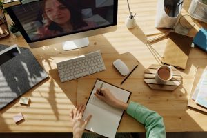 A woman on a video conferencing call in a coworking space.