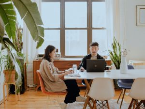 Two people working from a coworking space.