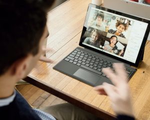 A man working from a coworking space on a laptop.