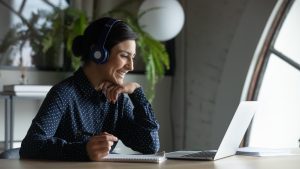 A woman having a virtual meeting.