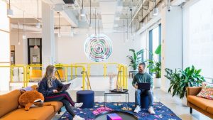 Two people working from a coworking space.