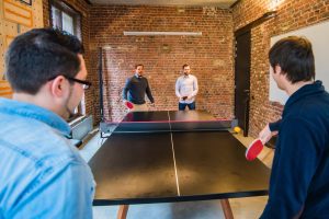 A group of people working from a coworking space.