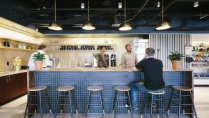 Two people working from a coworking space.