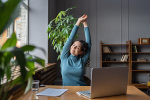 A woman relaxing at work.