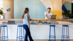 People socializing in a coworking space.