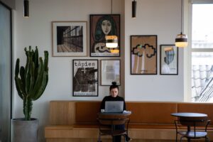 A girl freelancing in a flex office.