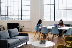 Two women working in a coworking office.