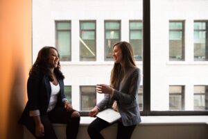 A view of two women in a coworking space.