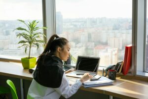 A view of a person working in a coworking space.